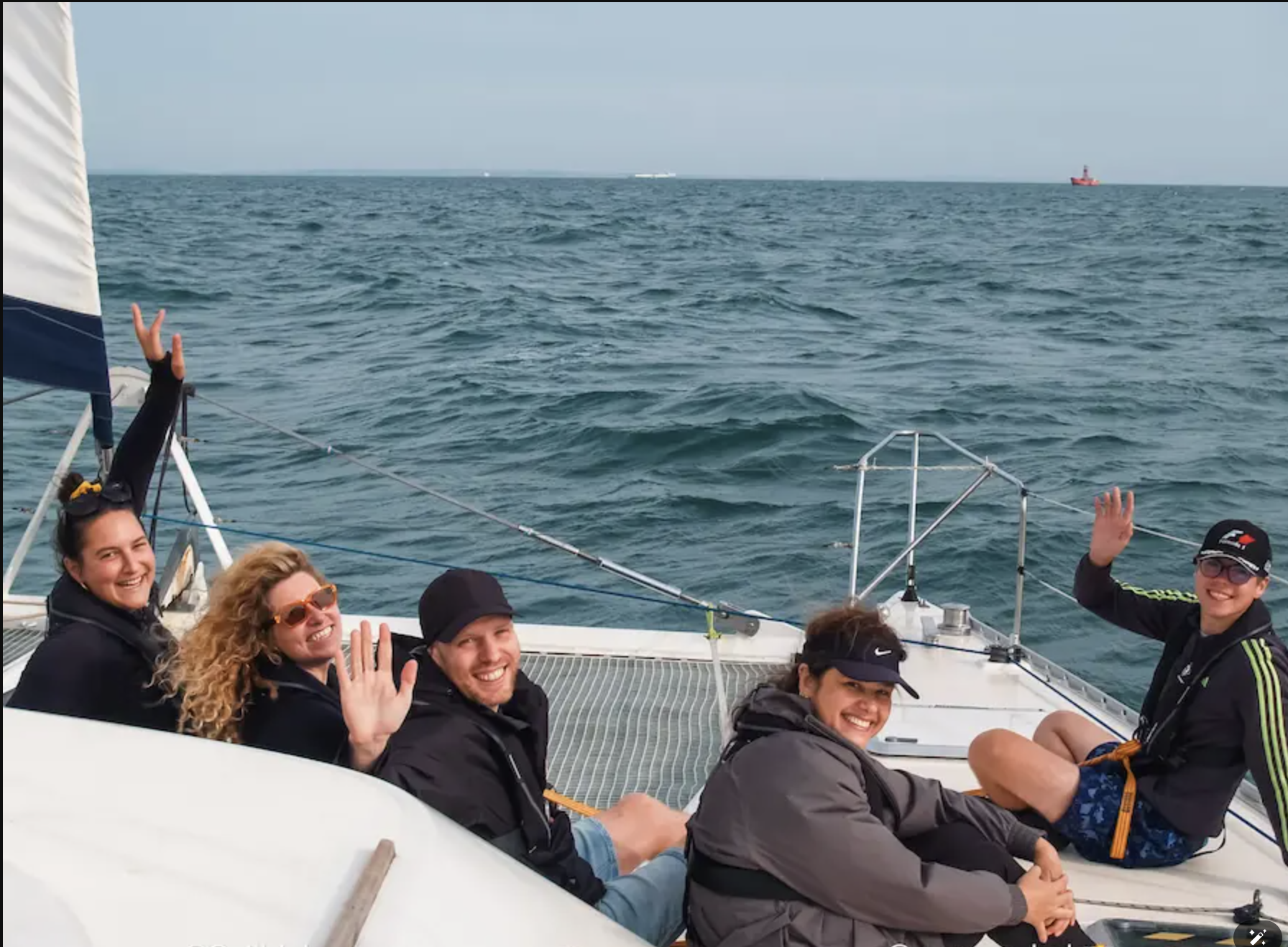 Passengers aboard a SailLink sailing catamaran