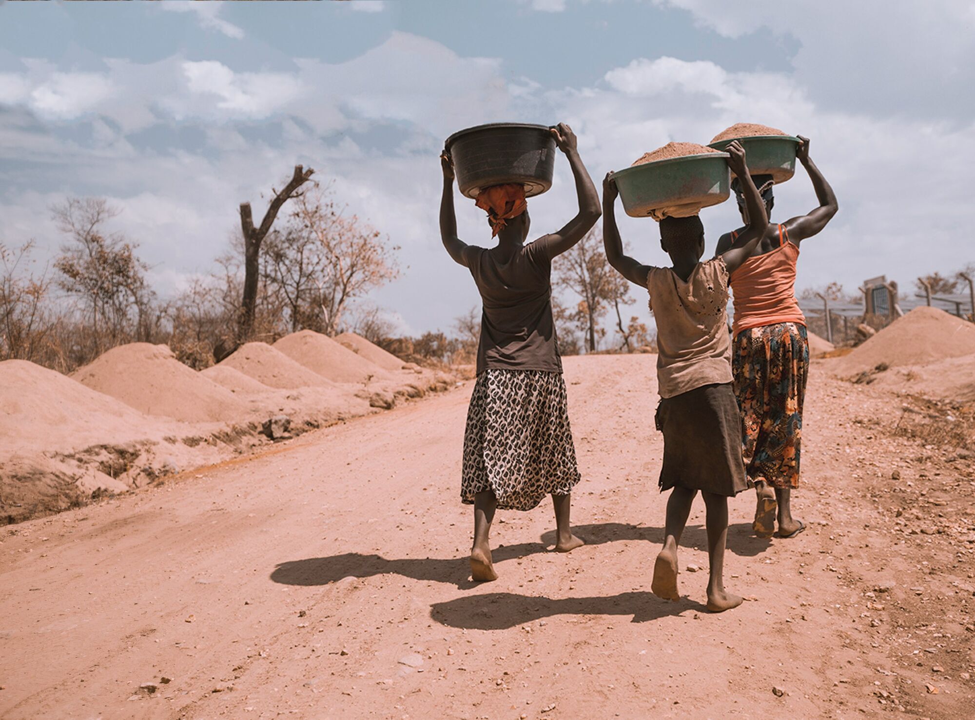 People walking along a rural road in Africa