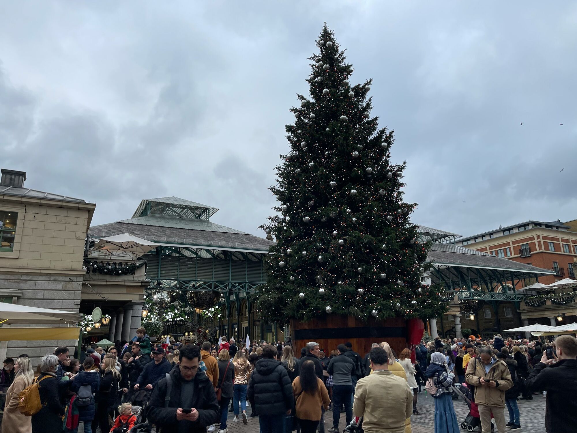 Crowds around a Christmas tree in London
