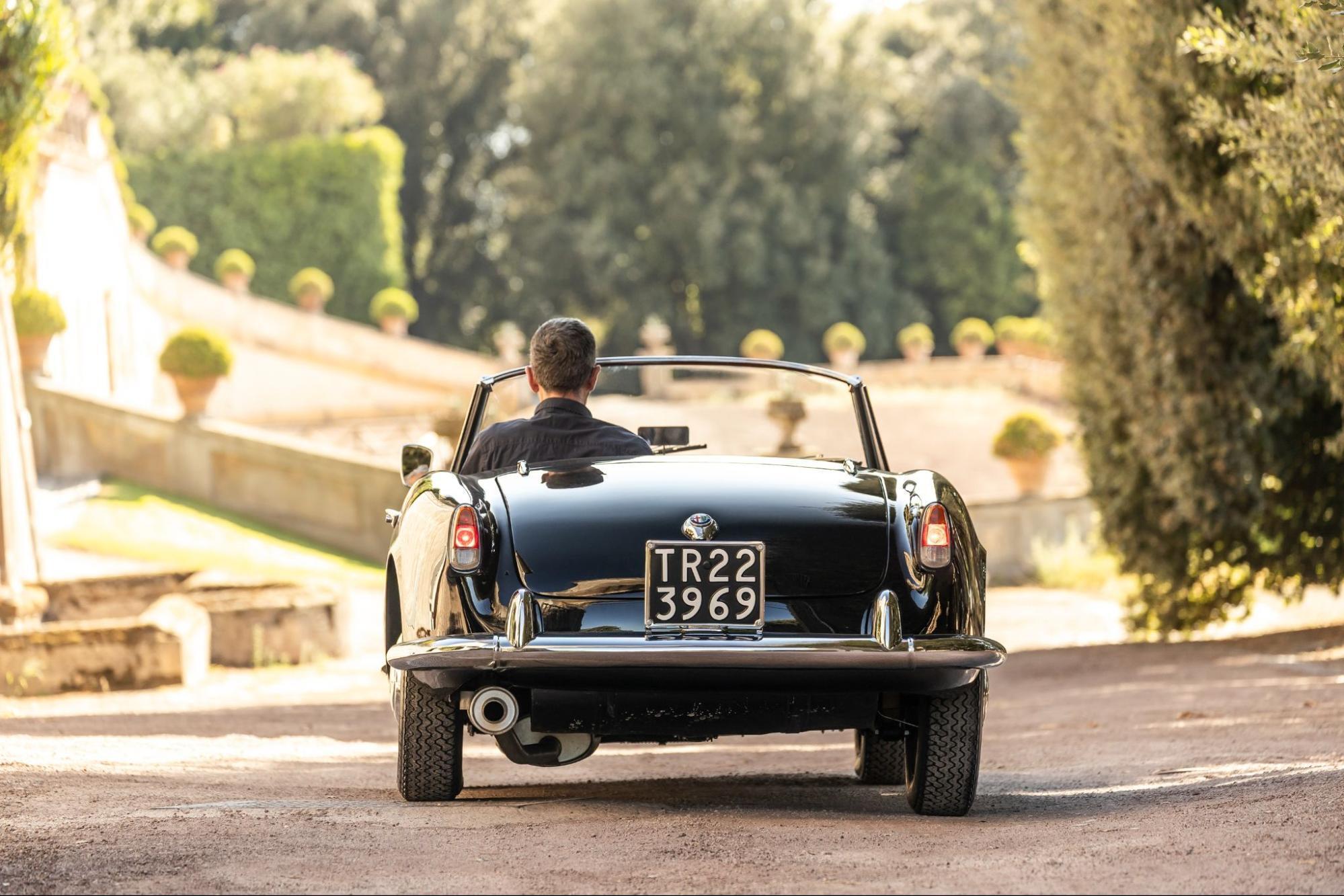 Classic Alfa Romeo convertible on an Italian road