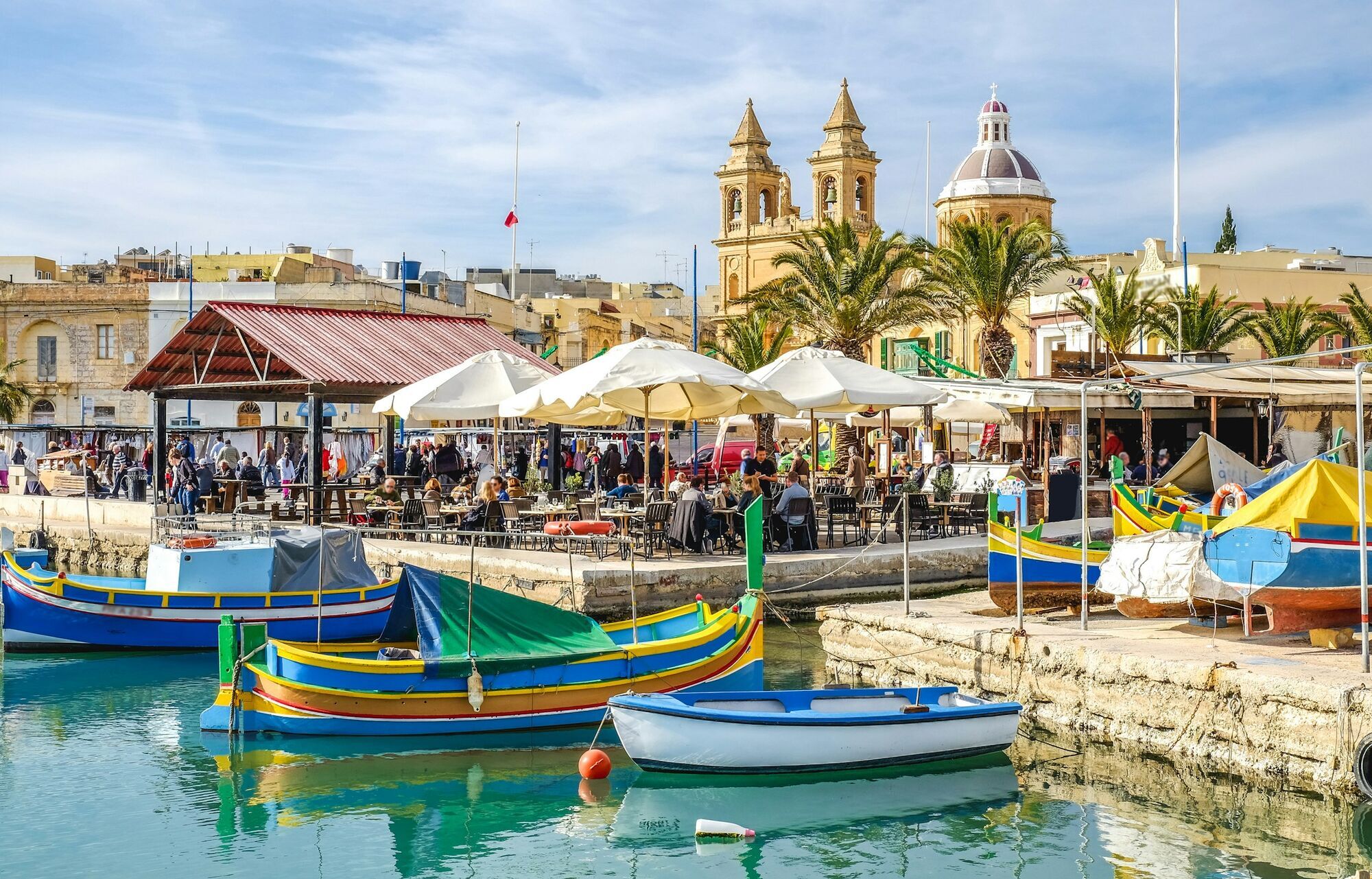 Colourful fishing boats in a Maltese harbour