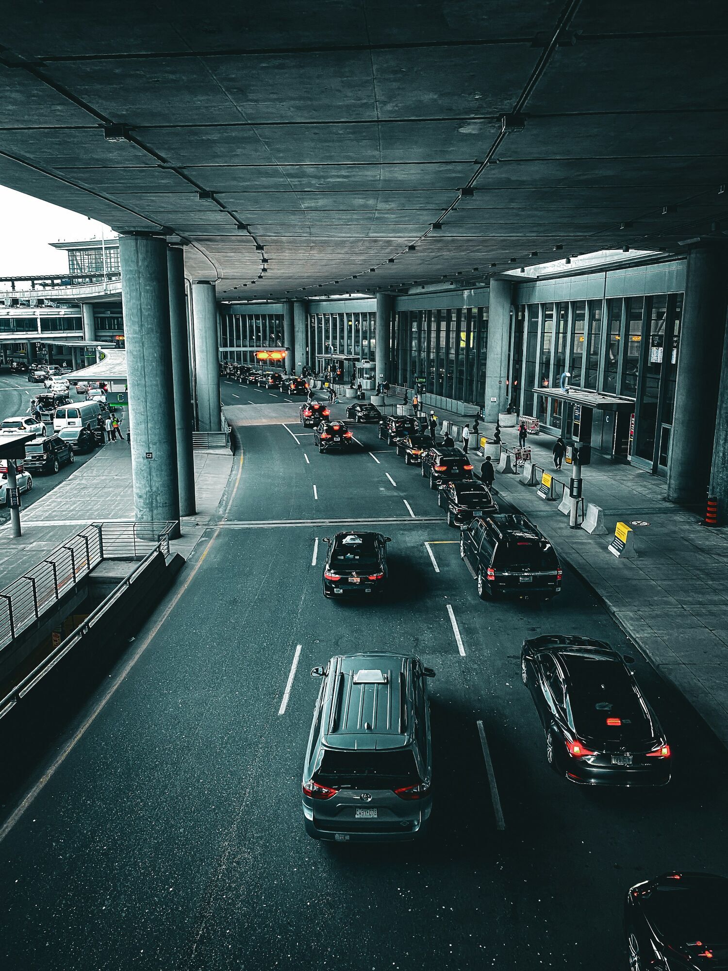 Vehicles outside an airport terminal entrance