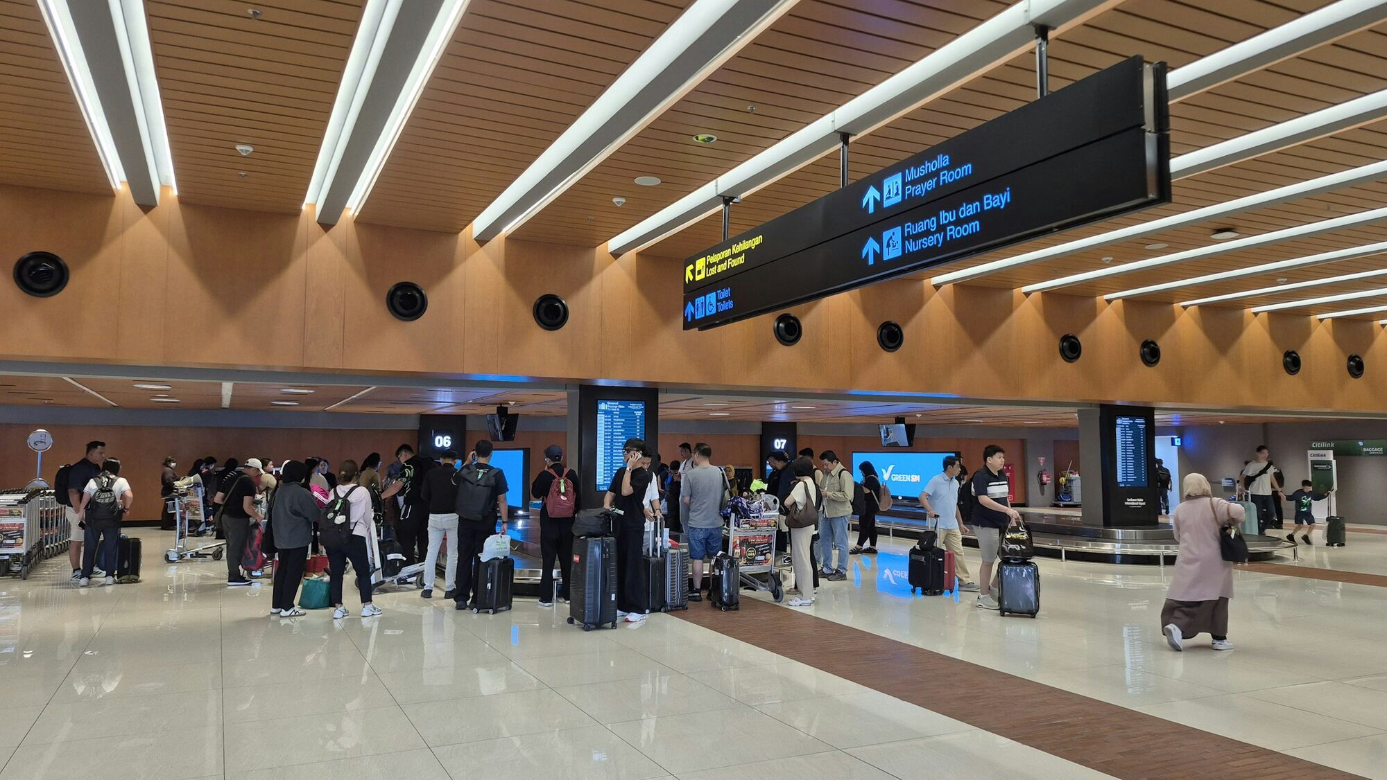 Passengers waiting inside an Indonesian airport
