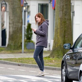 Pedestrians can be fined for using their phones and headphones