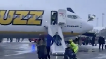 Ryanair Buzz passengers were evacuated due to smoke in the cabin. Video