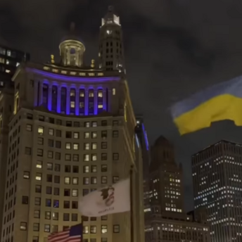 Christmas lights shine next to Ukrainian flags in Chicago