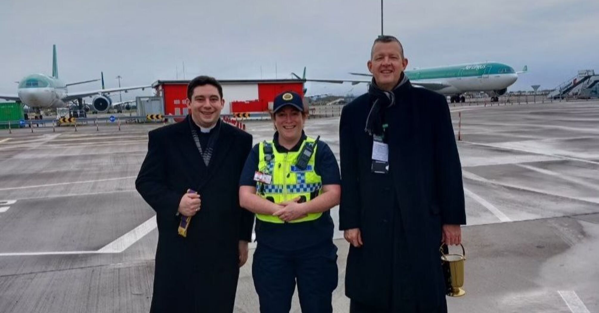 Priest blesses airplanes at Dublin airport for Christmas