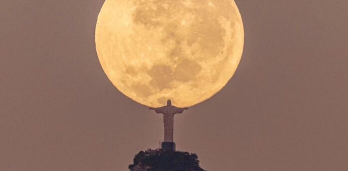 Statue of Christ The Redeemer in Rio de Janeiro holding the moon