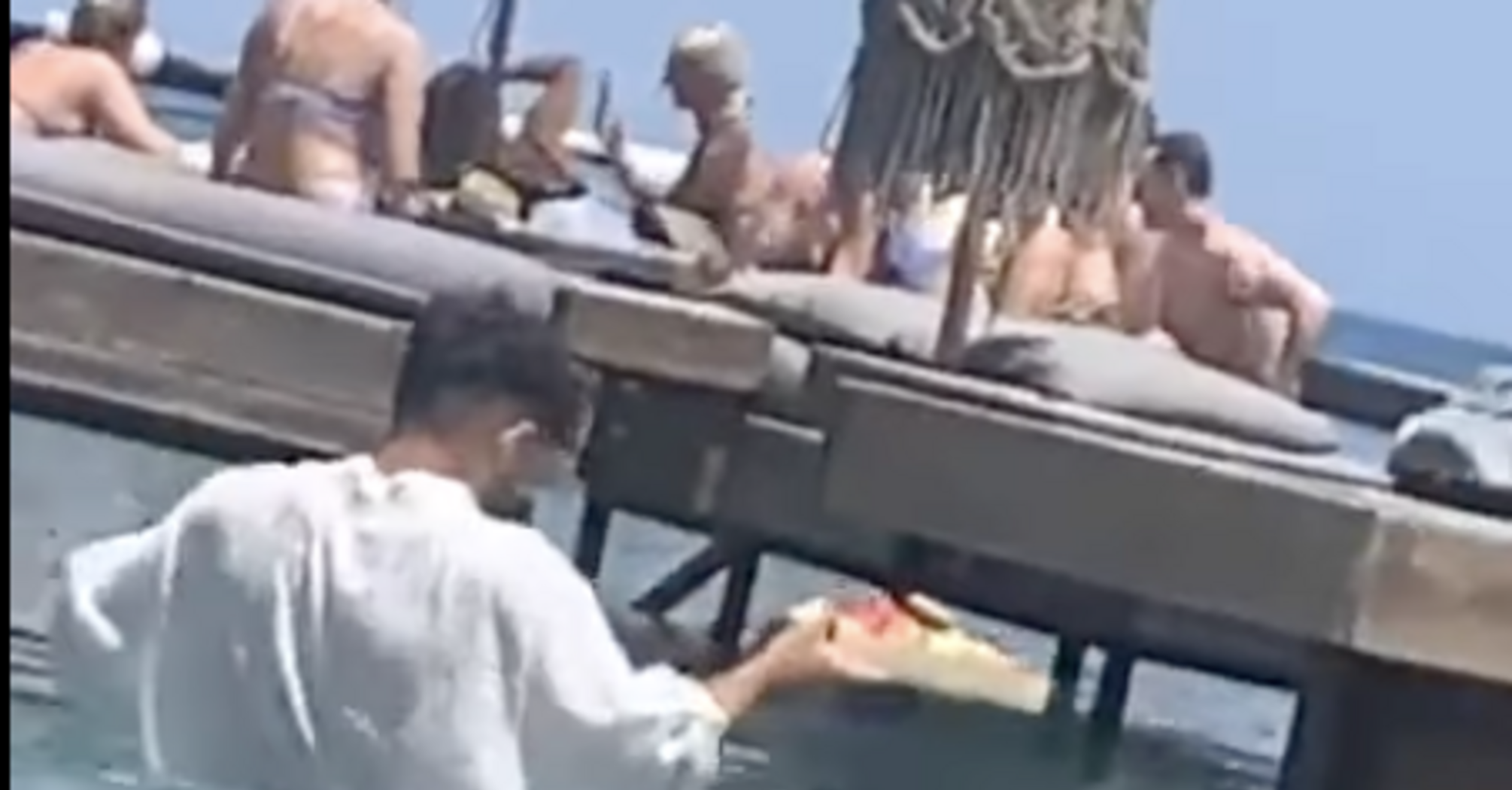 A scandal erupts in Greece over a bar where waiters served tourists while standing in water