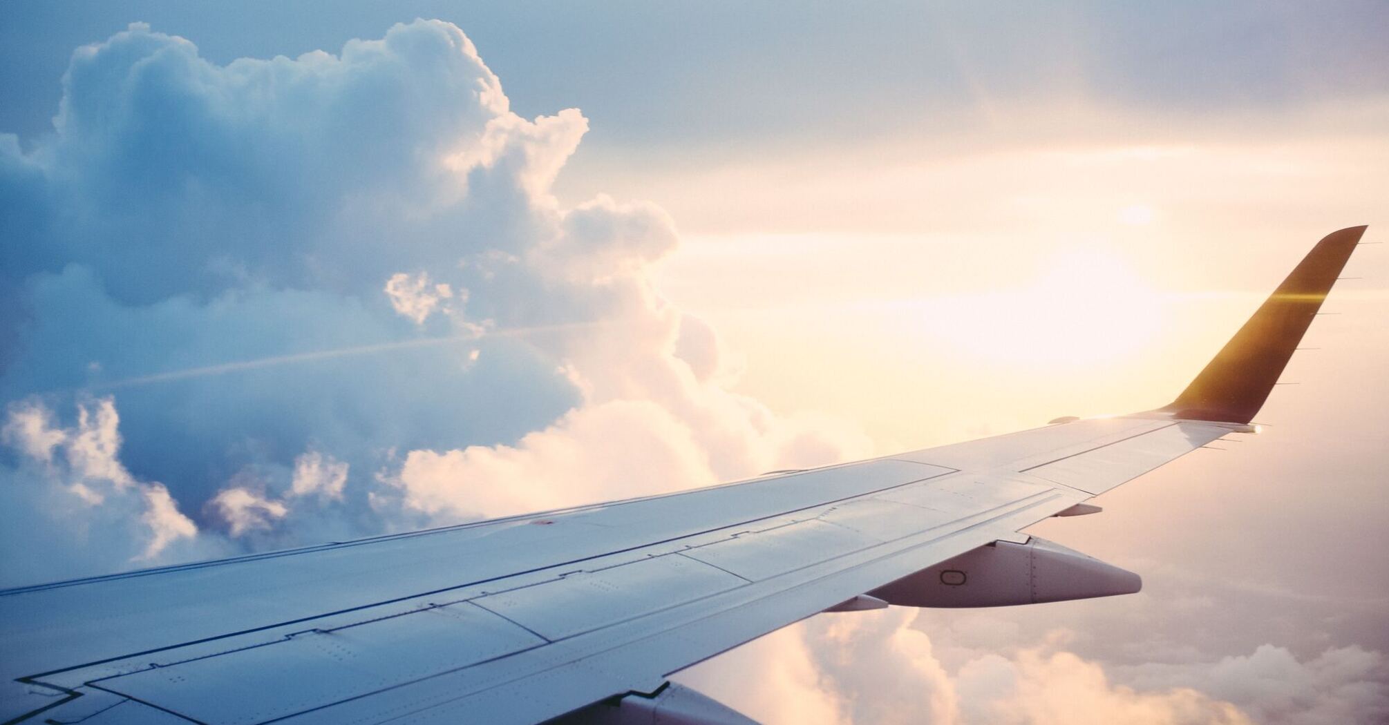 Airplane wing, clouds