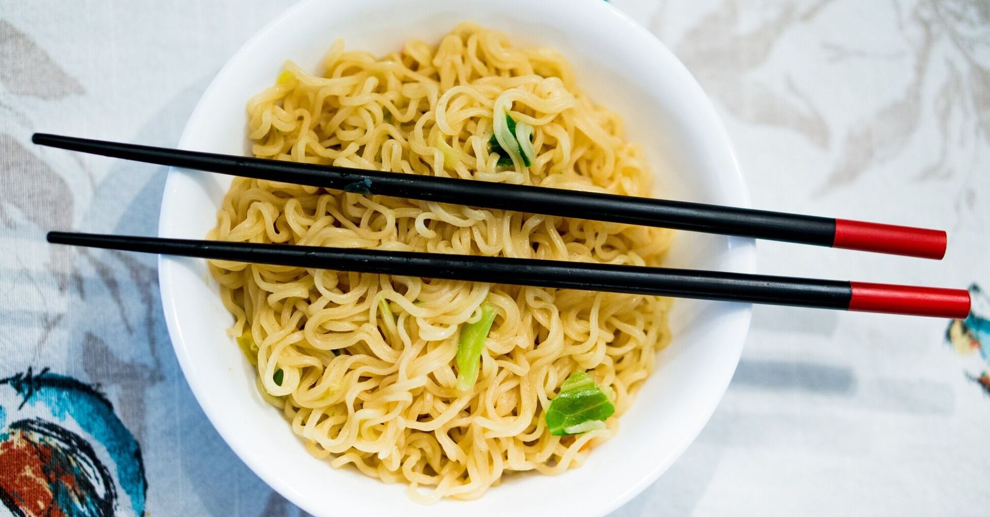 Noodles in a plate, chopsticks