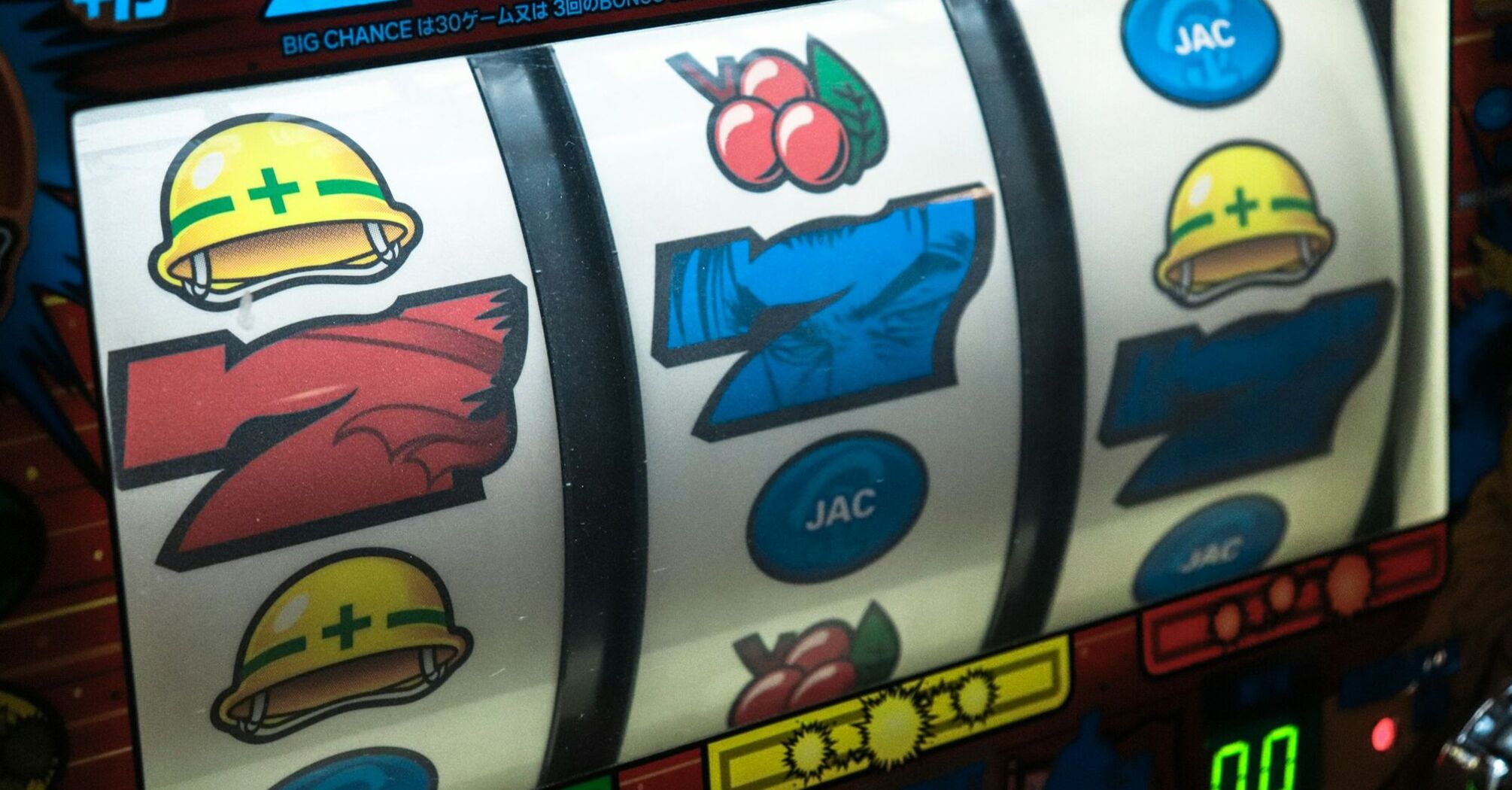 Slot machine displaying three seven