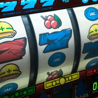 Slot machine displaying three seven