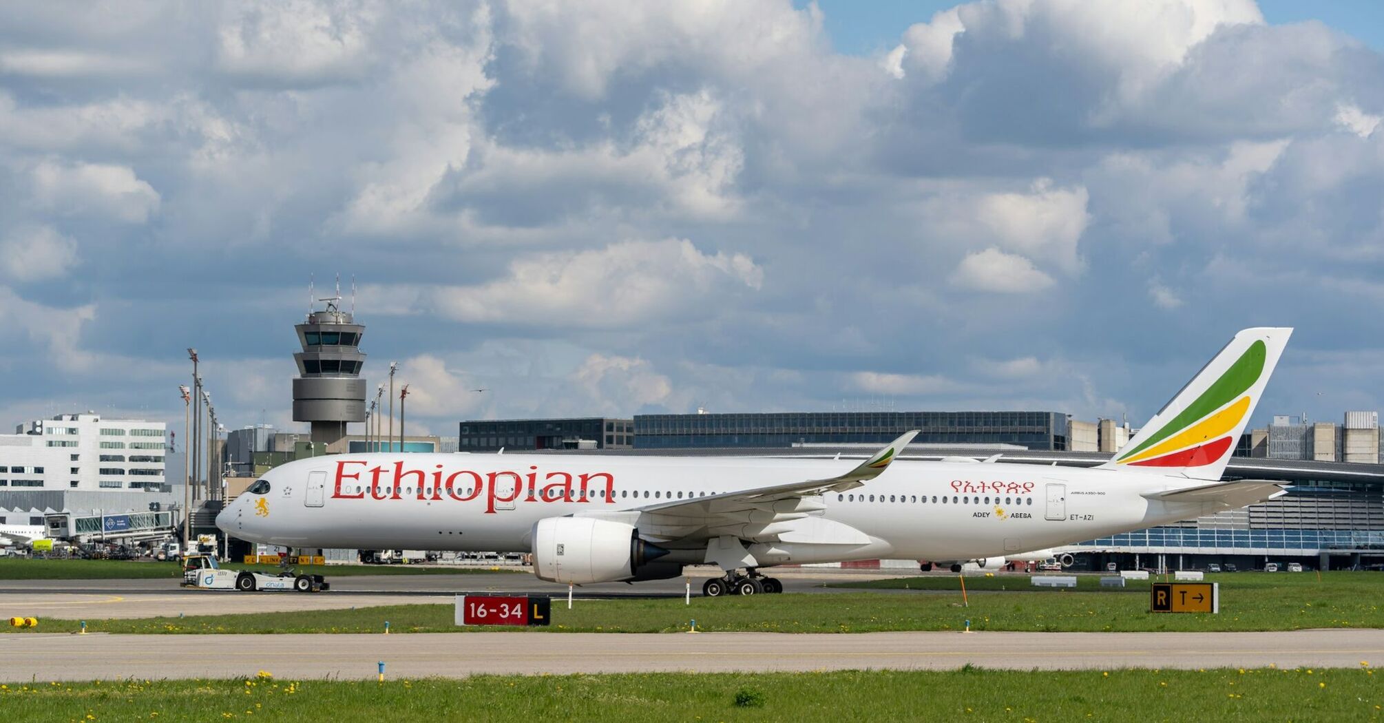 Ethiopian Airlines jetliner sitting on top of an airport runway