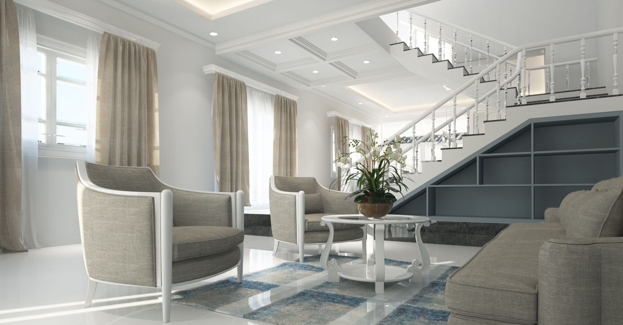 Modern living room interior with a staircase, gray armchairs, a white coffee table, and a sectional sofa in a bright, spacious setting