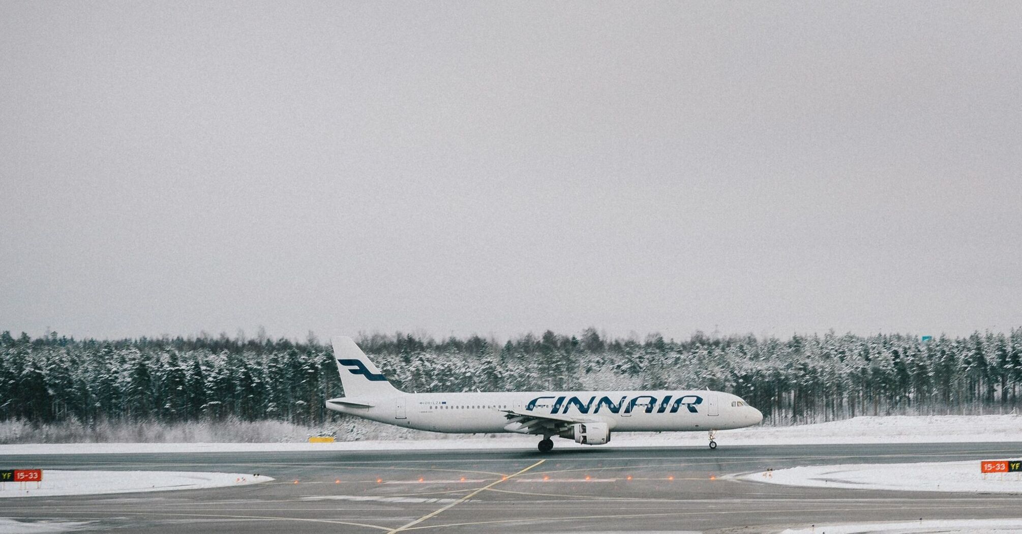 Finnair plane landing on snowy runway
