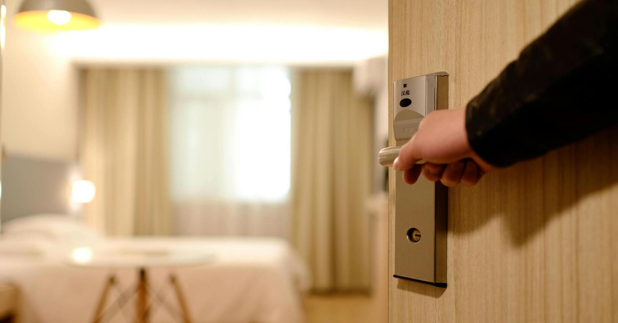 Opening the door to the hotel room