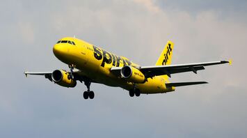 Spirit Airlines plane flying in the air