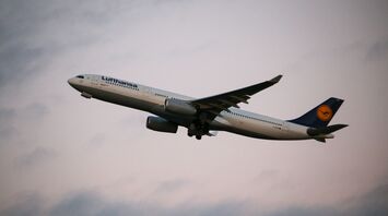 A Lufthansa A330 taking off in the sunset