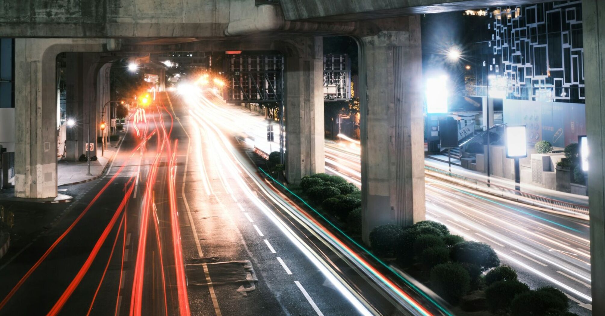 Elevated highway at night with blurred traffic lights