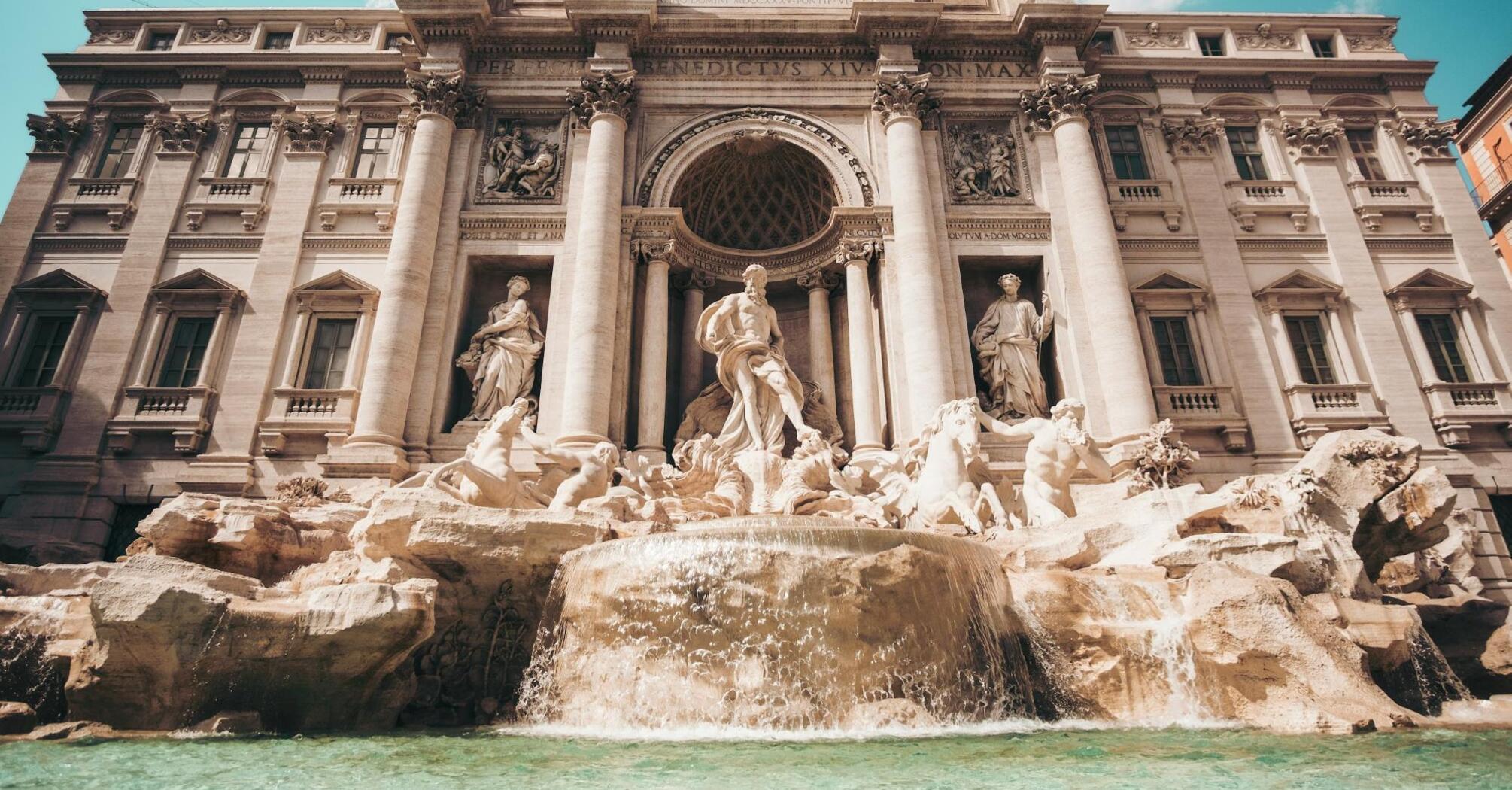 The majestic Trevi Fountain in Rome, showcasing its detailed Baroque sculptures and cascading waters