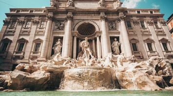 The majestic Trevi Fountain in Rome, showcasing its detailed Baroque sculptures and cascading waters