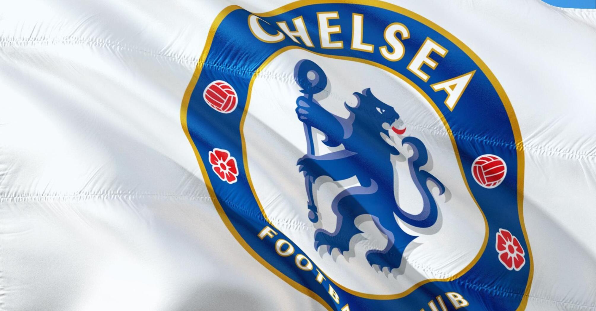 Chelsea Football Club flag waving against a blue sky