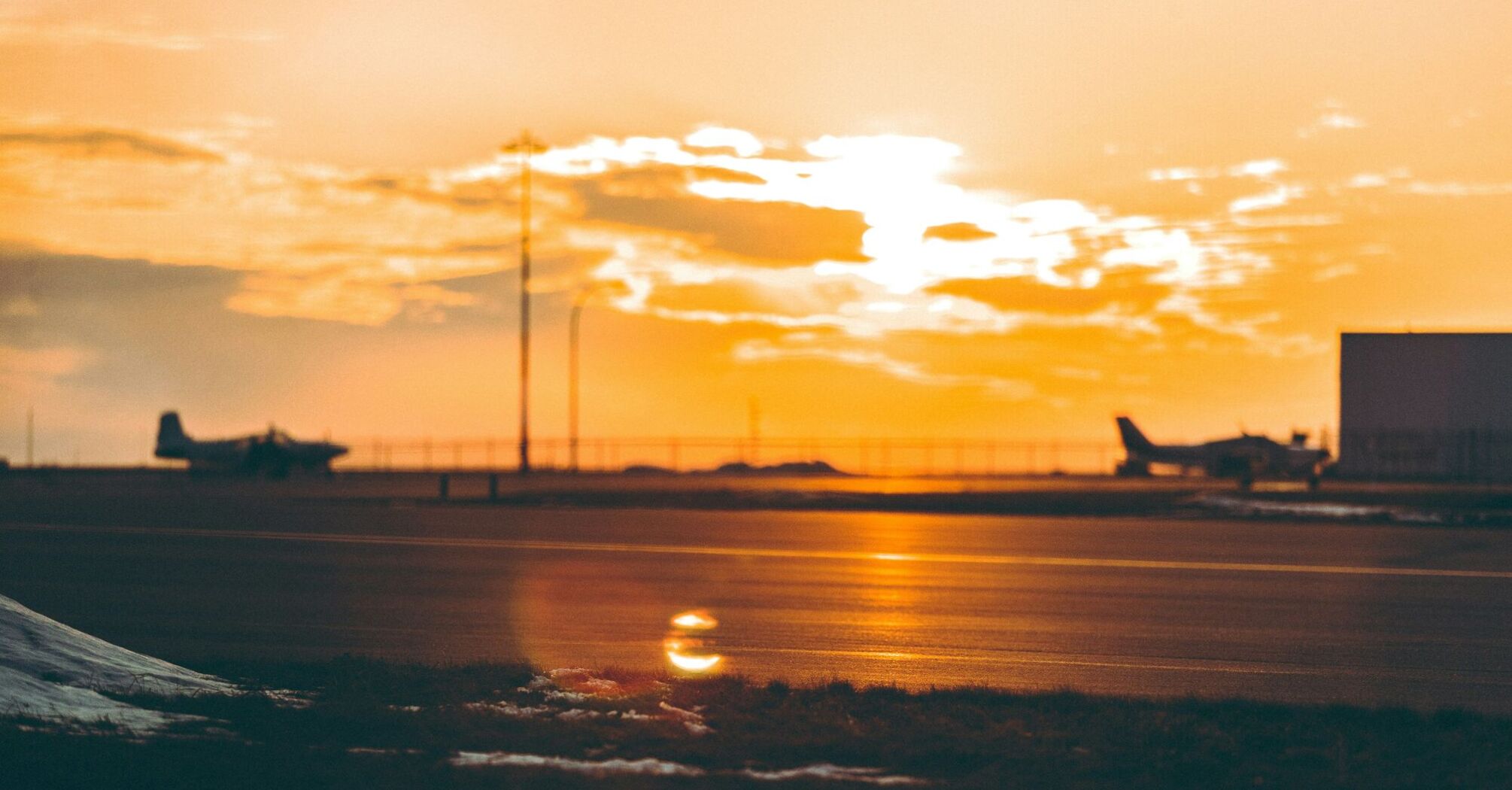 Airplane runway at sunset out of focus