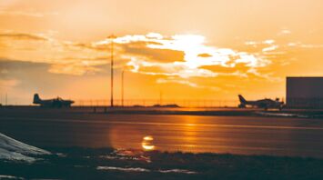 Airplane runway at sunset out of focus