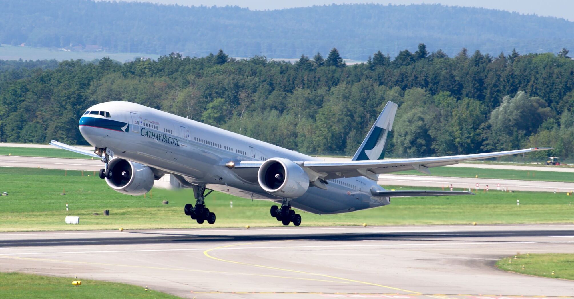 Cathay Pacific plane taking off from the runway