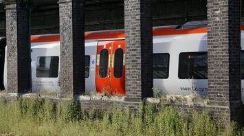 A Transport for Wales train seen through old station pillars, showcasing the new Class 756 tri-mode model