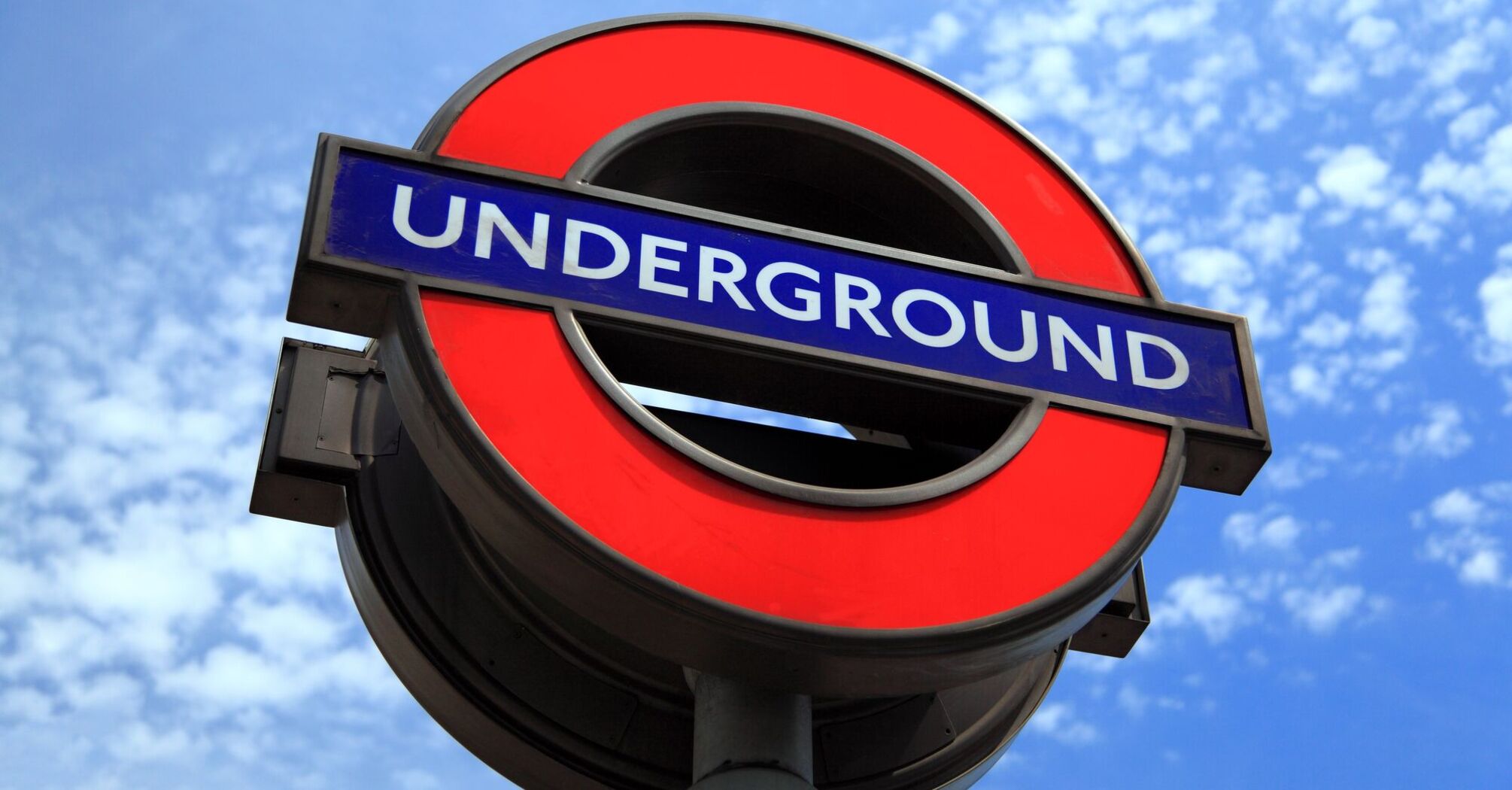 London Underground sign against a blue sky