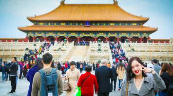 Tourists visiting the Forbidden City in Beijing, China