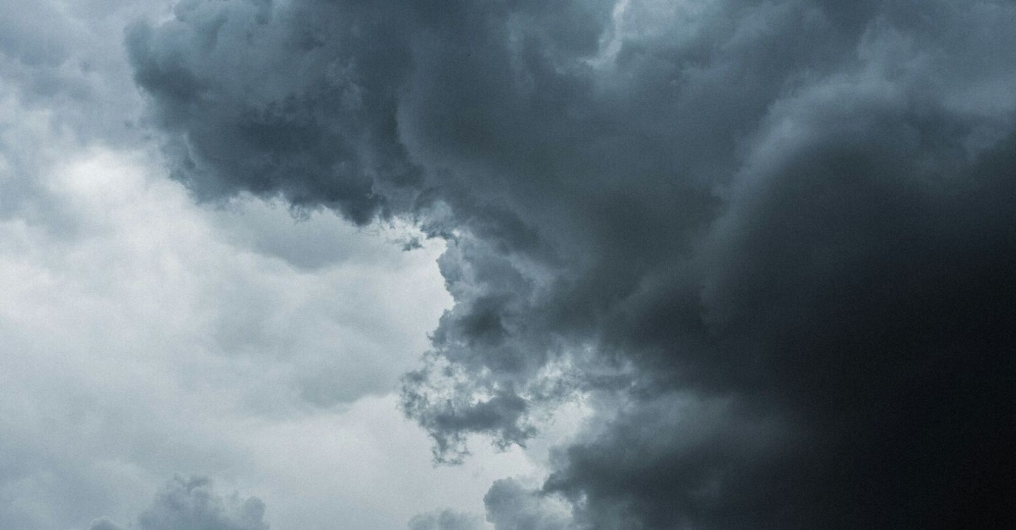 Dark storm clouds forming in the sky, signaling approaching severe weather