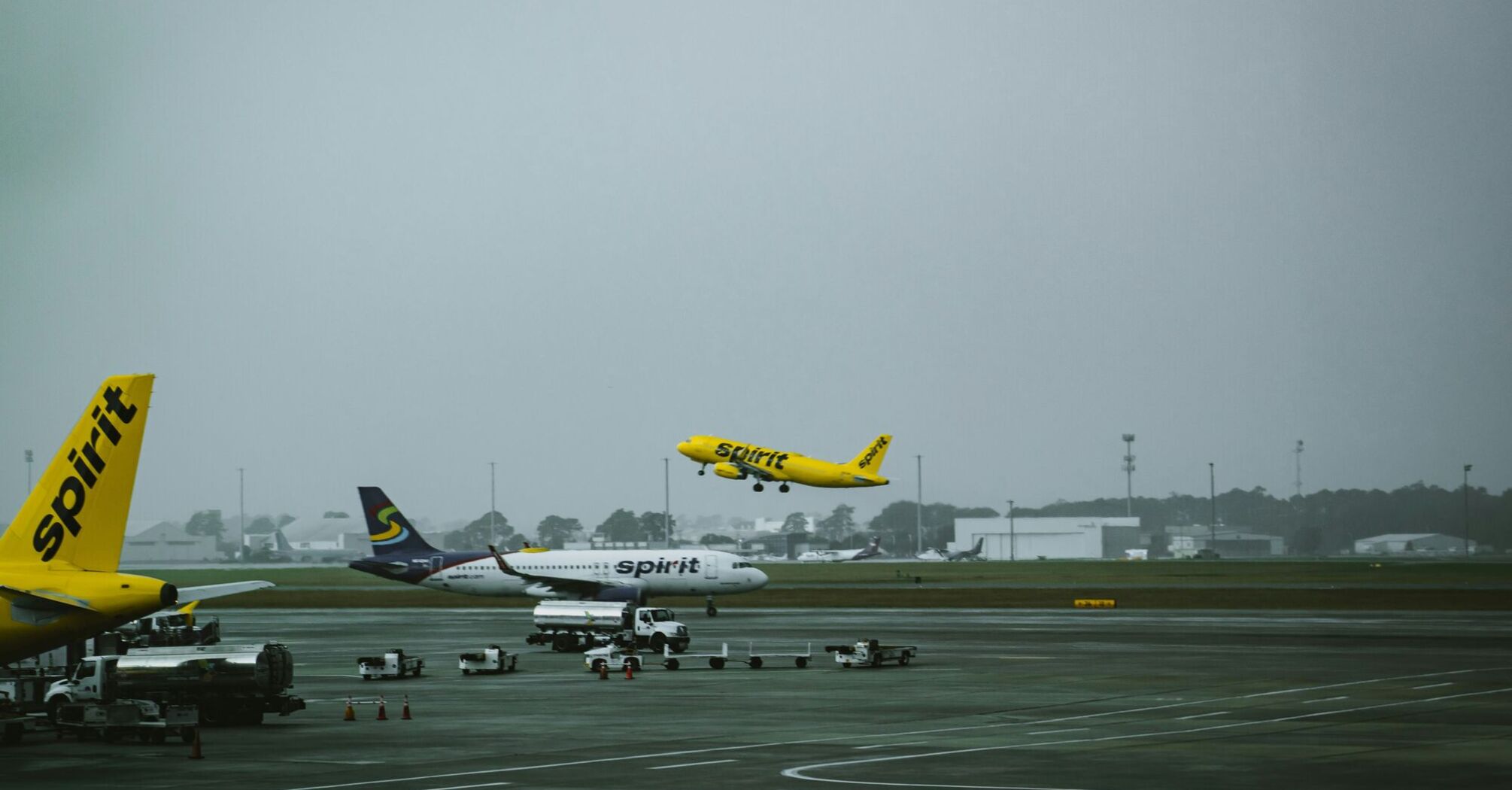 a group of airplanes at an airport