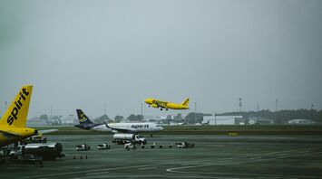 a group of airplanes at an airport