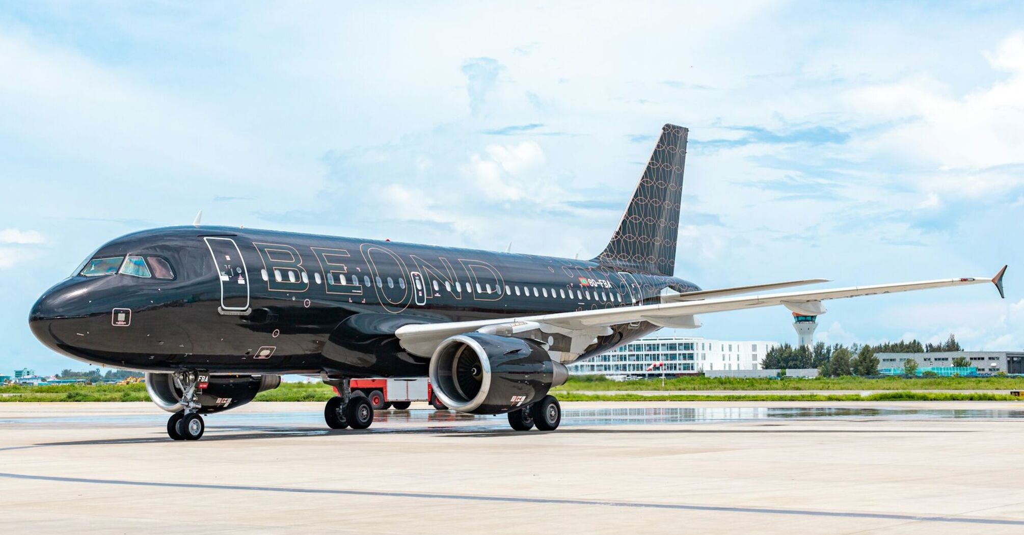 A beOnd premium airline jet parked on the runway