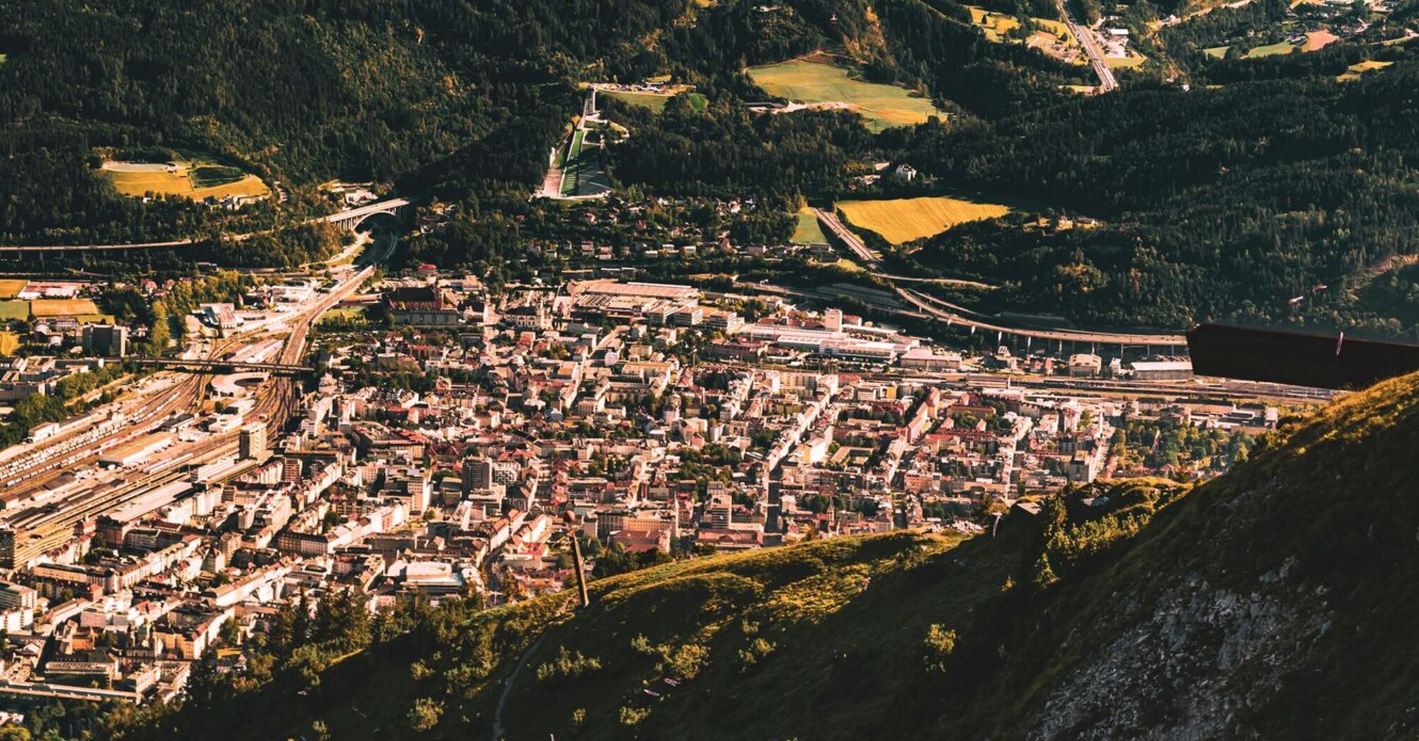 Aerial view of Innsbruck, Austria, surrounded by the Alpine mountains