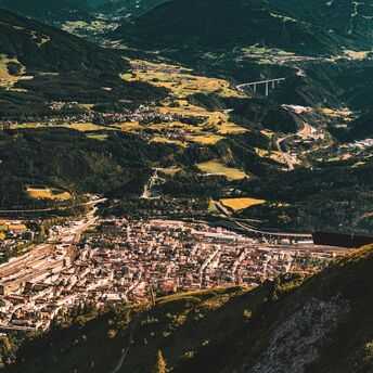 Aerial view of Innsbruck, Austria, surrounded by the Alpine mountains