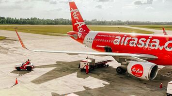 AirAsia aircraft preparing for departure on the tarmac at an airport