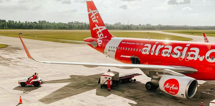AirAsia aircraft preparing for departure on the tarmac at an airport