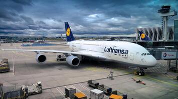 Lufthansa aircraft parked at the airport gate