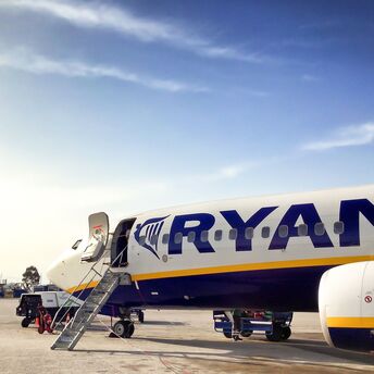 Ryanair plane on the ground with open boarding door