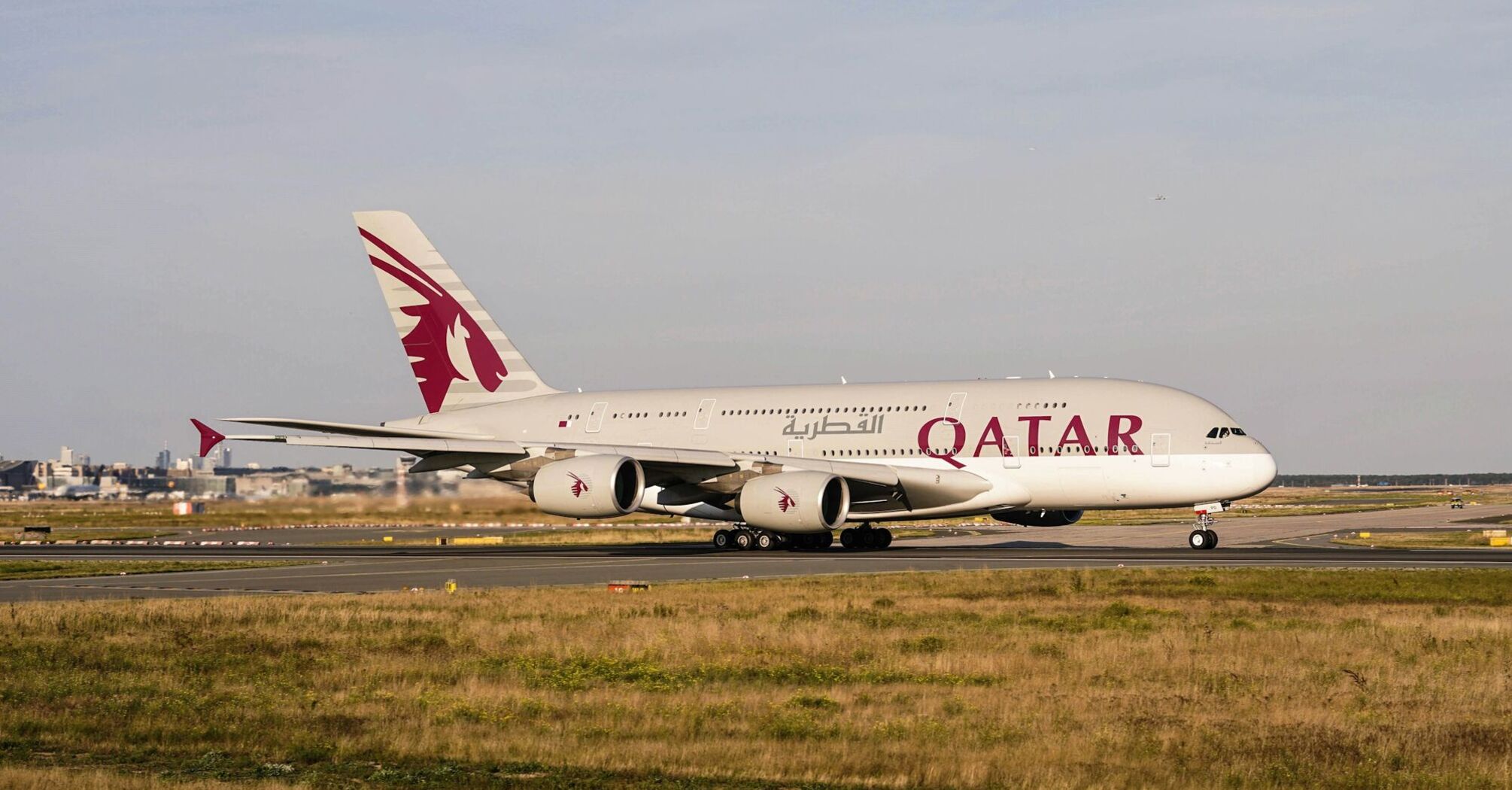 Qatar Airways airplane taxiing on the runway