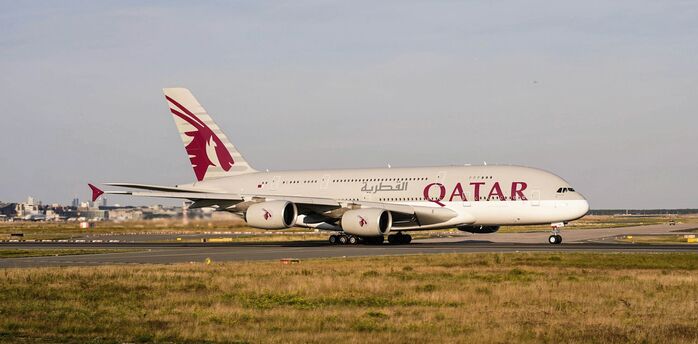 Qatar Airways airplane taxiing on the runway