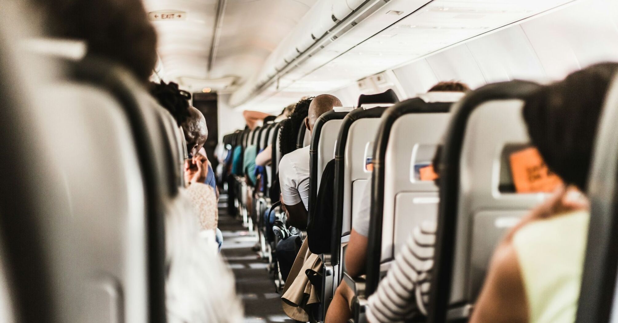 Passengers seated inside an airplane during a flight