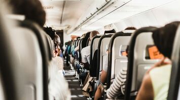 Passengers seated inside an airplane during a flight