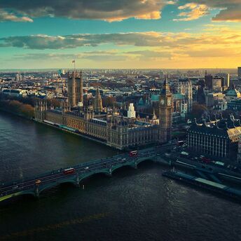 Aerial view of London with Big Ben and the Thames River at sunset