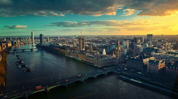 Aerial view of London with Big Ben and the Thames River at sunset