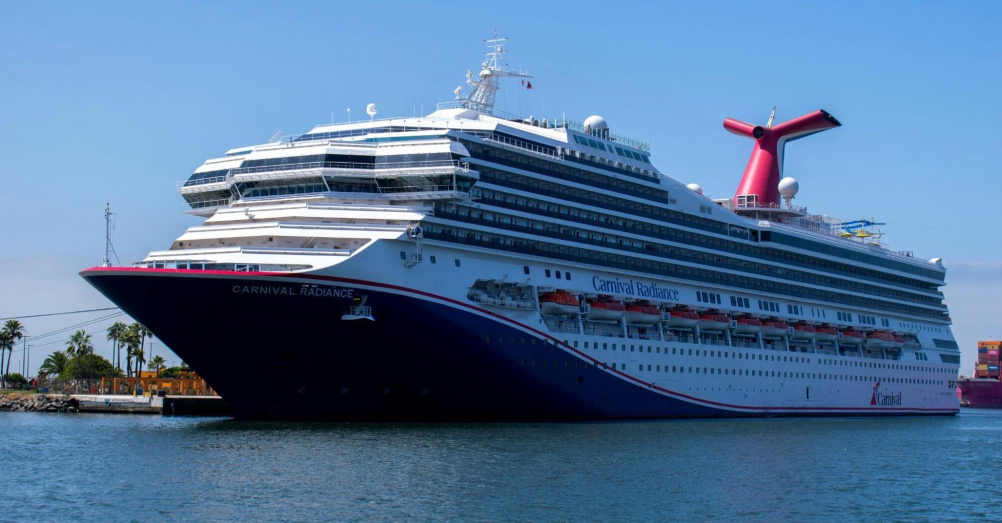 A large cruise ship docked at a sunny port